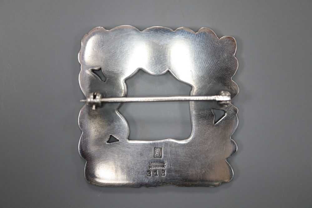 A George Jensen sterling Recumbent deer and squirrel square brooch, design no. 318, 37mm, 16.1 grams.